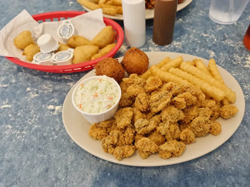 Calabash-style fried oyster plate with hushpuppies, slaw and fries