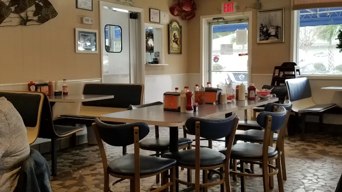 Coastal artwork on the walls of the dining room