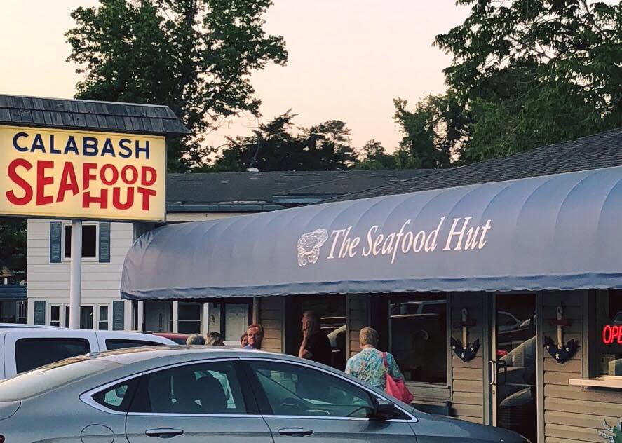 The blue awning over the entrance to Calabash Seafood Hut